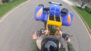 Wheeling Banshee with passenger at the lot