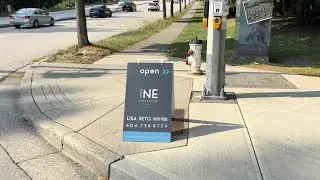 1NE Collective Realty Open House Sign Obstructing Sidewalk Curb Burnaby, BC near Edmonds Station.