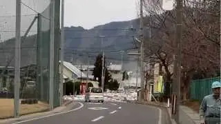 2011 Japan Tsunami: the water pouring over the seawall in Miyako [Stabilized]