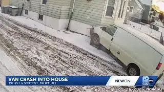 Surveillance video captures van crashing into home