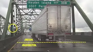 Crossing into Oregon from Washington on I-5 Interstate Bridge over Columbia River in the rain 2018