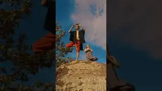 Man and woman doing yoga on a huge rock stress relief music everyday epic music