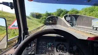 Scania 143 V8 hill climb through a tunnel.