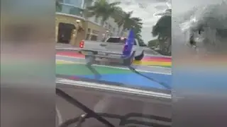 Man surrenders to police after video shows vandal damaging Pride Month rainbow