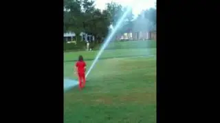 Playing in sprinklers