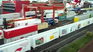 US Mail engine leads the USPS postal cars past the Heljan container crane yard
