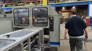 Uniloy Milacron 12-Head Reciprocating Screw Blow Molder.