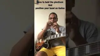 Guitar lesson 1.1; How to hold plectrum and position your hand on guitar.