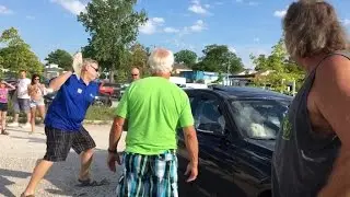 Watch This Man Use a Rock To Smash a Car Window to Save Dog In Hot Car