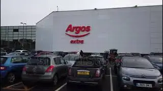 stock footage birmingham uk busy argos extra store with people and cars parked