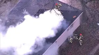 Sky 5 shows crews battling fire at Norman home