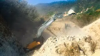 Excavator Carving a Road into the Solid Mountain Rock Face | Excavator Planet