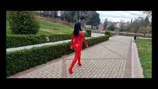 VICTORIA DEVIL - Brunette in passion red. Shiny latex catsuit and high boots.