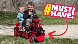 JOYLDIAS 2-Seater Ride-On Train &ndash; 12V Electric Kids Car with Music, Lights, Whistle & Storage