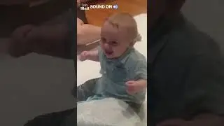 Excited baby meets new puppy for the first time