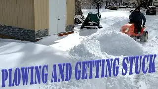 Kubota GR2010 and Bobcat 418 plowing snow and getting stuck