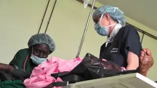 Dr. Thomas with patient before surgery