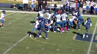 Canton Lions JV RB Willie Wilborn keeps his feet moving on 7 yard run vs. Sterling Heights Kodiaks