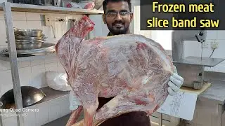 Fresh full frozen meat cutting on bandsaw machine