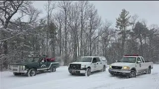 Crews trying to rescue 13 people who slid off snowy north Georgia mountain in cars