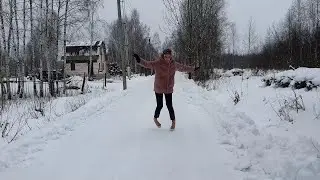 Сlumsy girl on high heels sandals trying to walk on slippy snow, high heels on ice (scene 651)