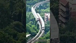 Two Light Rail Trains Pass Each Other on an S-Curve Elevated Track