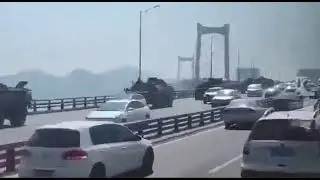PLA military vehicles on the move on a bridge close to Kinmen, Fujian province