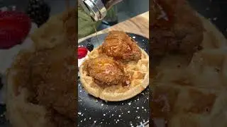 The FRIED CHICKEN & WAFFLES from The Grotto BK in Brooklyn, NYC are incredible! 🍗🧇 #DEVOURPOWER