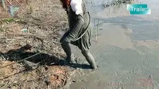 Girl with red skirt and red hair swimming in mud