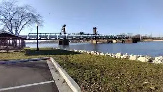 COLD December train scene along Illinois River. Omnitrax rare bridge move