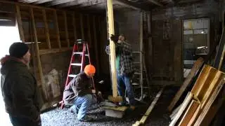 Car jacking the roof of barn