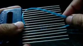How to make a petal of a  tiny loops flower with quilling comb