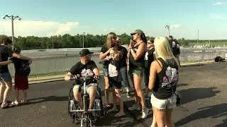 Local lineman injured in storms meets racing team who held fundraiser