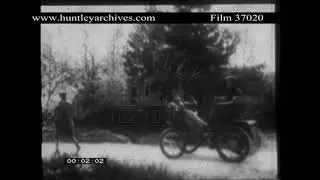 Early Motor Car preceded by Man with Red Flag.  Archive film 37020