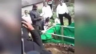 JAMAICAN WOMAN JUMP IN HER MAN GRAVE AT FUNERAL