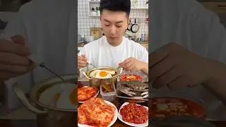 Enjoy eating a delicious meal of bibimbap made with kimchi and crab sauce.