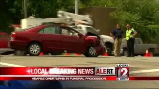 Hearse overturns in funeral procession