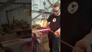 Guy is twisting hand forged bars!