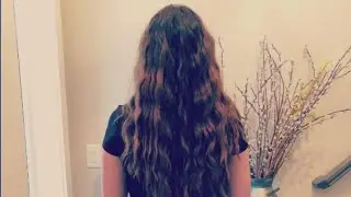 Woman saves long locks of hair during chemo
