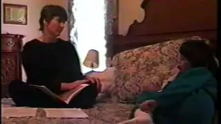 Adult reading BL on bed w Marcy Text Structure