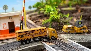 Toy Train - Truck Cars Pass The Railroad Tracks