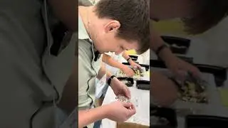 Vintage Watch Dealer Inspects Watch Movements at NAWCC Show