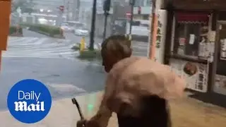 Senior citizen in Japan gets blown backwards by Typhoon Jebi