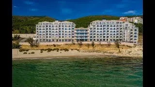 Onyx Beach Residence overview of the building and the beach