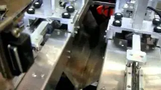 Automatic double head tag staple machine.avi