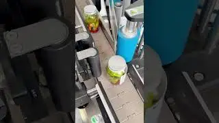 Fully automatic labeling machine, bottle and can labeling.