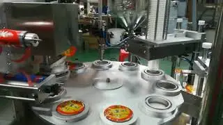 Rotary cup filling closing machine