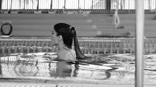 Woman - swimming in a pool - ULTRA SLOW MOTION