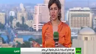 woman tv news reporter in orange satin wind swept blouse