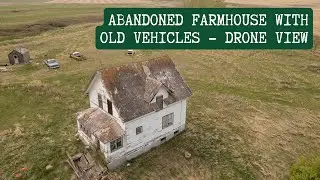 Abandoned Prairie Farm with Old Vehicles Still Sitting Outside